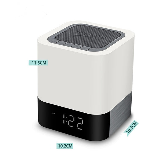 White Bluetooth speaker with LED night light, digital clock.