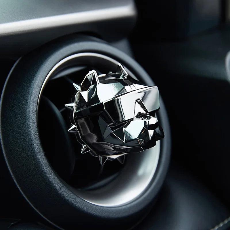 Black bulldog car vent diffuser inside circular vent.