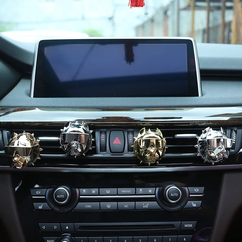 Luxury car interior with multiple bulldog vent diffusers across air vents.