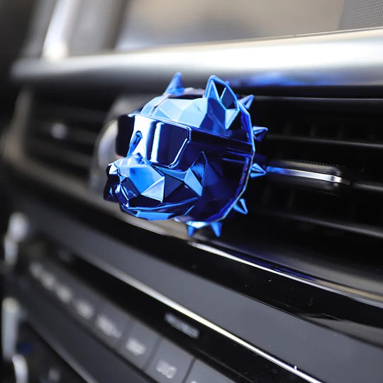 Blue bulldog car vent diffuser attached to horizontal car vent.