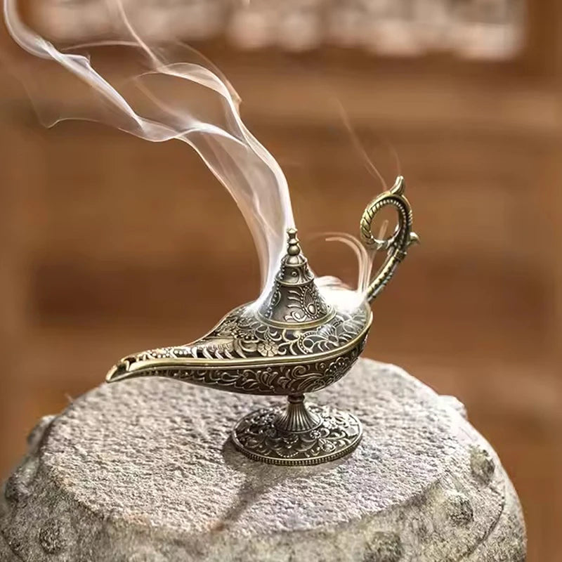 Arabic antique lamp incense holder with intricate patterns and incense smoke rising.