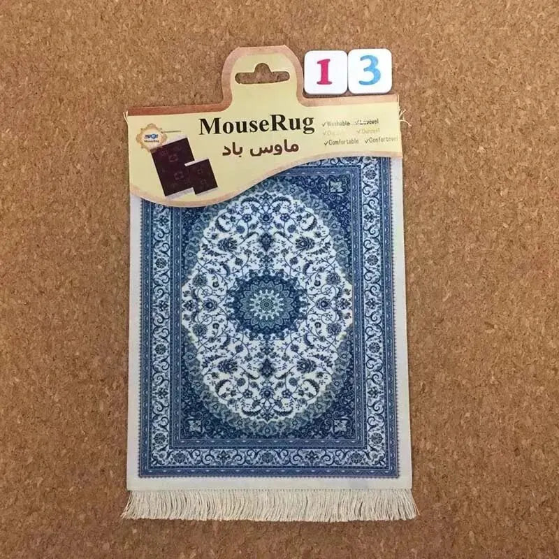 MiniRug blue oriental mouse pad packaged with label on corkboard background