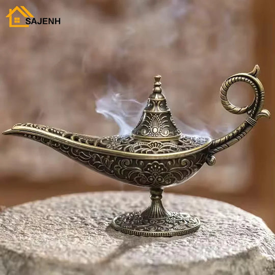 Antique Aladdin’s lamp incense burner releasing smoke, ornate metal design on stone surface.