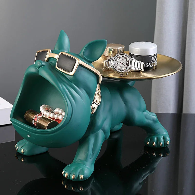Green bulldog valet tray with gold sunglasses and decorative tray, holding rings and accessories