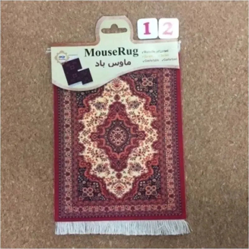 Oriental-style red mini rug mouse pad on wooden desk surface