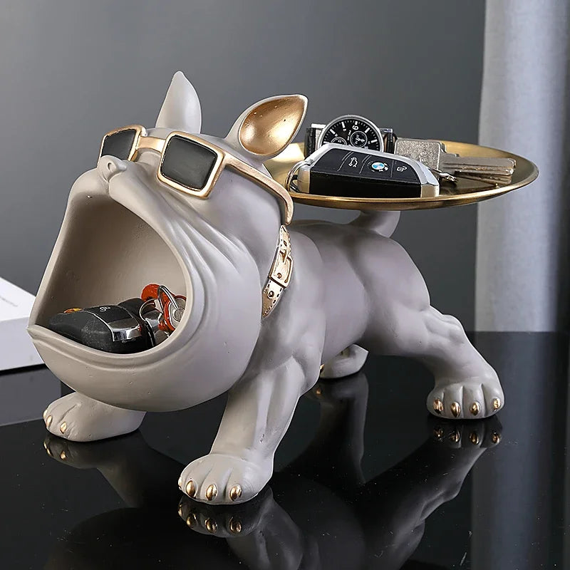 White bulldog valet tray with gold details and open mouth storage, used as jewelry or watch holder