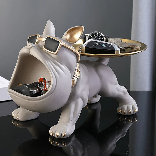 White bulldog valet tray with gold details and open mouth storage, used as jewelry or watch holder