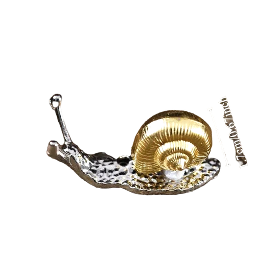 Silver snail incense holder with spiral shell design, compact incense stand for meditation décor.