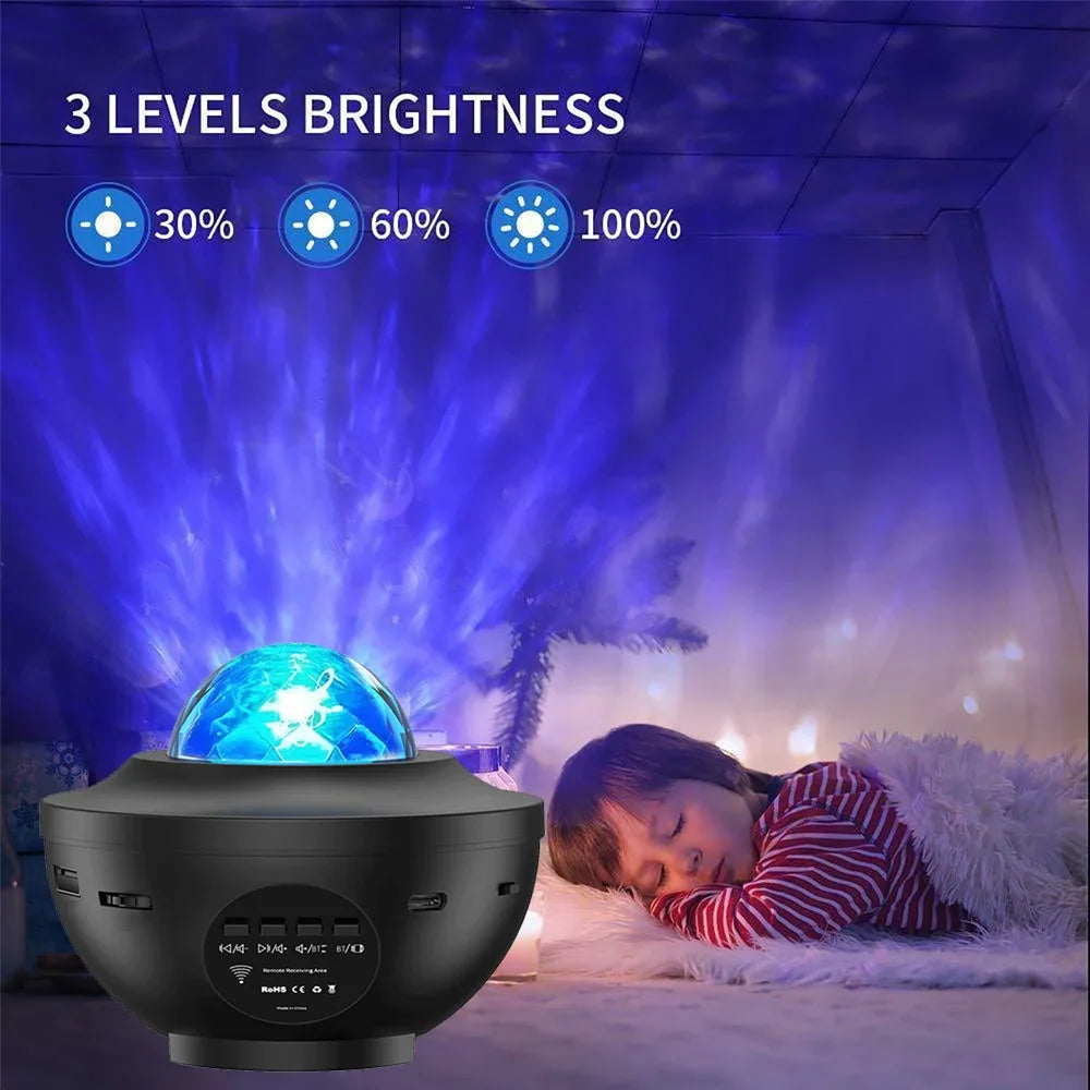 Black night light projector with blue light projection on a child sleeping in a bedroom.