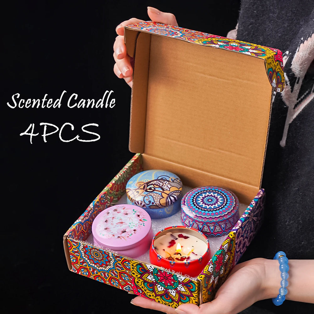 Four-piece scented soy candle gift set with floral and crystal accents in decorative tin box.