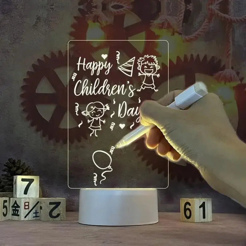 Glowing LED message board with handwritten Christmas greeting on acrylic surface.