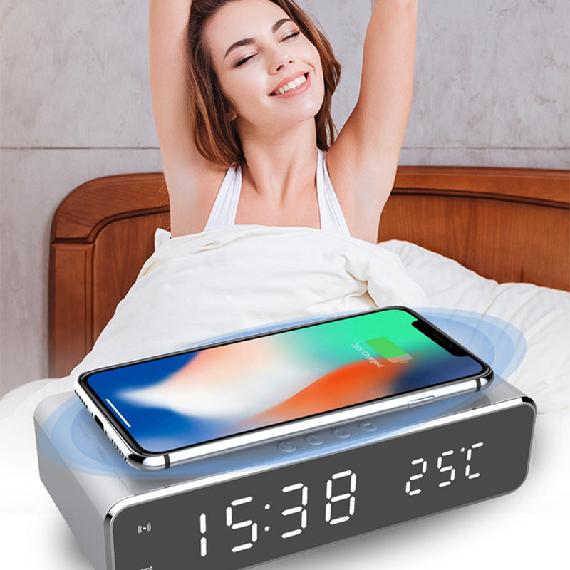 Woman waking up refreshed beside LED alarm clock with phone wirelessly charging on top